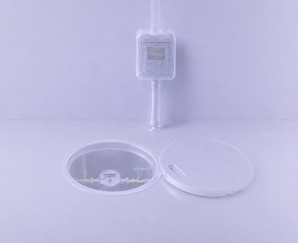 Translucent render of a wall-mounted water meter and an in-ground meter chamber reporting over NB-IoT